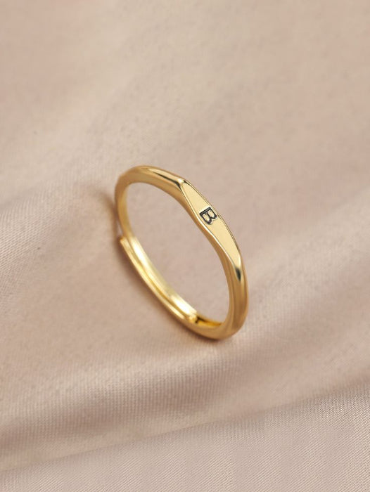 Gold ring with a small engraving by ziva style