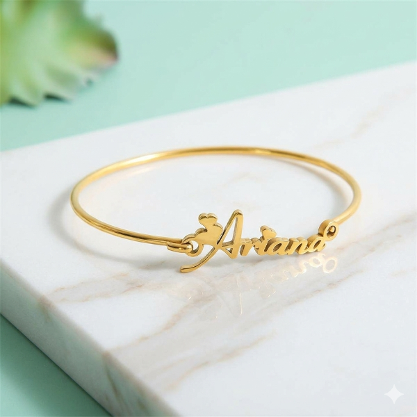 Gold bracelet with 'Ariana' engraving by ziva style